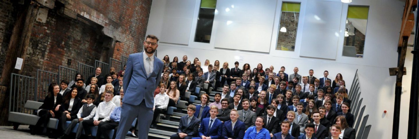 Image showing the principal of NEFUTC and a class of students in the main auditorium